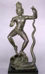 Bronze sculpture of Krishna dancing on the serpent Kaliya, from South India’s Chola dynasty; placed by Pindell near her work for its energy and spiritual resonance.